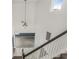 Aerial view of the staircase highlighting the soaring ceilings and natural light from the upper-level window at 2347 123Rd E Pl, Parrish, FL 34219