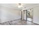 Bedroom with ceiling fan, wood-look floors, and mirrored closet at 2383 Lakeside Mews # D3, Sarasota, FL 34235