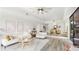 Open floor plan featuring living and dining area with stylish furnishings and a large window to the patio at 2383 Lakeside Mews # D3, Sarasota, FL 34235