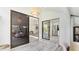Open living space with sliding glass doors, a view of kitchen and living room, and bright, natural light at 2383 Lakeside Mews # D3, Sarasota, FL 34235