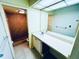 Bathroom features a vanity with a sink, mirror, and a tiled shower at 2607 29Th W Ave, Bradenton, FL 34205