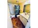 Bathroom with tiled floors, a tub and shower, a toilet, and a vanity with a sink at 2607 29Th W Ave, Bradenton, FL 34205