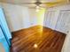 Bedroom with hardwood floors, closet and sliding glass door to balcony at 2607 29Th W Ave, Bradenton, FL 34205