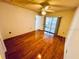 Bedroom featuring hardwood floors and sliding glass door to backyard at 2607 29Th W Ave, Bradenton, FL 34205