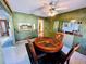 The dining room has a round table, four chairs, and a view into the kitchen at 2607 29Th W Ave, Bradenton, FL 34205