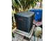 Outdoor HVAC unit with some nearby garbage bins at 2607 29Th W Ave, Bradenton, FL 34205