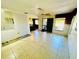 Bright living room features tile flooring, ceiling fan, and ample natural light at 2607 29Th W Ave, Bradenton, FL 34205