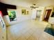 Bright living room with tile floors, natural light, and a ceiling fan at 2607 29Th W Ave, Bradenton, FL 34205
