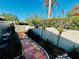 Paver patio bordered with lush landscaping and white privacy fence at 2607 29Th W Ave, Bradenton, FL 34205
