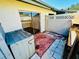Private patio featuring a sliding glass door, storage, and a privacy fence at 2607 29Th W Ave, Bradenton, FL 34205
