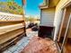 Private outdoor patio featuring tile pavers, a wooden shelf, and privacy fence at 2607 29Th W Ave, Bradenton, FL 34205