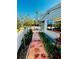 Charming patio with a paver walkway and vibrant greenery offering a private outdoor retreat at 2607 29Th W Ave, Bradenton, FL 34205