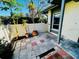 A tiled patio with potted plants and a white privacy fence at 2607 29Th W Ave, Bradenton, FL 34205