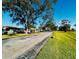 Street view of community with mature trees and well-maintained landscaping at 2607 29Th W Ave, Bradenton, FL 34205