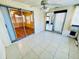 Bright and sunny sunroom showcases tile floors and sliding glass doors at 2607 29Th W Ave, Bradenton, FL 34205