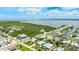 Overhead view showcasing the property's location near a waterway and lush foliage at 2713 Avenue C, Holmes Beach, FL 34217