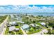 Aerial view showcases the waterfront community with stunning bay views and a serene residential neighborhood at 2713 Avenue C, Holmes Beach, FL 34217