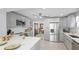 Bright kitchen featuring stainless steel appliances, white countertops, and ample storage at 2713 Avenue C, Holmes Beach, FL 34217