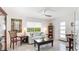 Cozy living room featuring neutral decor, a ceiling fan, and lots of natural light at 2713 Avenue C, Holmes Beach, FL 34217