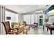 Airy living space showcasing a comfortable seating area and bright, sheer curtains for natural light at 2713 Avenue C, Holmes Beach, FL 34217
