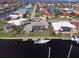 Expansive aerial view of the waterfront property, showcasing the pool, private dock, and canal access at 2807 Coral Way, Punta Gorda, FL 33950
