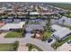 Aerial view of a waterfront community with homes along canals and a large body of water in the distance at 2807 Coral Way, Punta Gorda, FL 33950