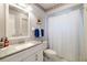 Bathroom featuring white vanity and tiled shower at 2807 Coral Way, Punta Gorda, FL 33950