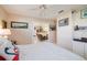 Bright bedroom with white floors, furnishings, and access to the kitchen at 2807 Coral Way, Punta Gorda, FL 33950