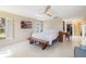Bright bedroom with bench, desk and view to hallway and walk-in closet at 2807 Coral Way, Punta Gorda, FL 33950