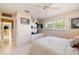Bright bedroom with white floors, a bed, window and access to hallway at 2807 Coral Way, Punta Gorda, FL 33950