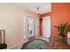 Bright foyer featuring decorative glass front door, neutral flooring, and a glimpse into other rooms at 2807 Coral Way, Punta Gorda, FL 33950