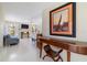 Hallway features a console table, artwork, and a living area at 2807 Coral Way, Punta Gorda, FL 33950