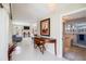 Hallway features a console table, artwork, and access to a bathroom at 2807 Coral Way, Punta Gorda, FL 33950