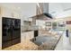 Modern kitchen with granite countertops, stainless steel appliances at 2807 Coral Way, Punta Gorda, FL 33950