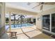 Screened-in patio with view of the pool and canal at 2807 Coral Way, Punta Gorda, FL 33950