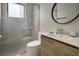 Modern bathroom with a glass-enclosed shower, sleek vanity, and stylish fixtures, offering a luxurious experience at 289 Long Meadow Ln, Rotonda West, FL 33947