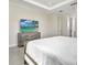 Spacious bedroom with a large television and modern dresser, offering comfort and entertainment at 289 Long Meadow Ln, Rotonda West, FL 33947