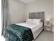 Cozy bedroom with a comfortable bed, bedside table, neutral colors, and a relaxing atmosphere at 289 Long Meadow Ln, Rotonda West, FL 33947
