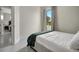 Bright bedroom with a modern bed, view of nature, and a soothing color palette at 289 Long Meadow Ln, Rotonda West, FL 33947