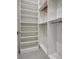 Bright, organized walk-in closet with white shelving and hanging space at 289 Long Meadow Ln, Rotonda West, FL 33947