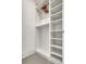Bright, organized walk-in closet with white shelving and hanging space at 289 Long Meadow Ln, Rotonda West, FL 33947
