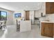 Modern kitchen with white cabinets, stainless steel appliances, a central island with seating, and recessed lighting at 289 Long Meadow Ln, Rotonda West, FL 33947