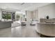 Open-concept living room with recessed lighting, modern furniture, and sliding glass doors to the exterior at 289 Long Meadow Ln, Rotonda West, FL 33947