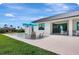 A beautiful backyard featuring a modern pool with chairs and an umbrella, perfect for relaxation and outdoor entertainment at 289 Long Meadow Ln, Rotonda West, FL 33947