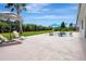 Beautiful backyard and pool with lounge chairs and lush landscaping at 289 Long Meadow Ln, Rotonda West, FL 33947