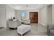 Modern sitting area with neutral tones, stylish furniture, and a decorative wooden door at 289 Long Meadow Ln, Rotonda West, FL 33947