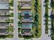 Overhead view of residences with solar panels, featuring a backyard pool and neatly arranged neighborhood at 305 Siena Vista Pl, Sun City Center, FL 33573