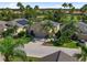 Inviting single-story home featuring solar panels, a two-car garage, and lush landscaping at 305 Siena Vista Pl, Sun City Center, FL 33573
