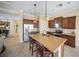 Spacious kitchen features a large island with seating, stainless steel appliances, and ample cabinet space at 305 Siena Vista Pl, Sun City Center, FL 33573