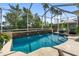 Inviting screened-in pool with three elegant water fountains, providing a luxurious outdoor retreat at 305 Siena Vista Pl, Sun City Center, FL 33573